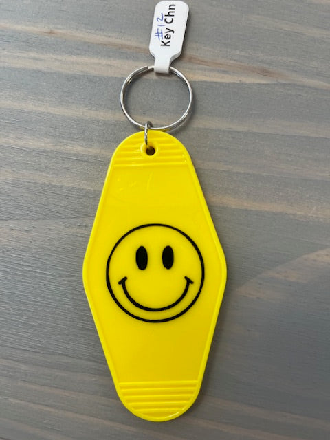 Smiling Face Motel Key Chain
